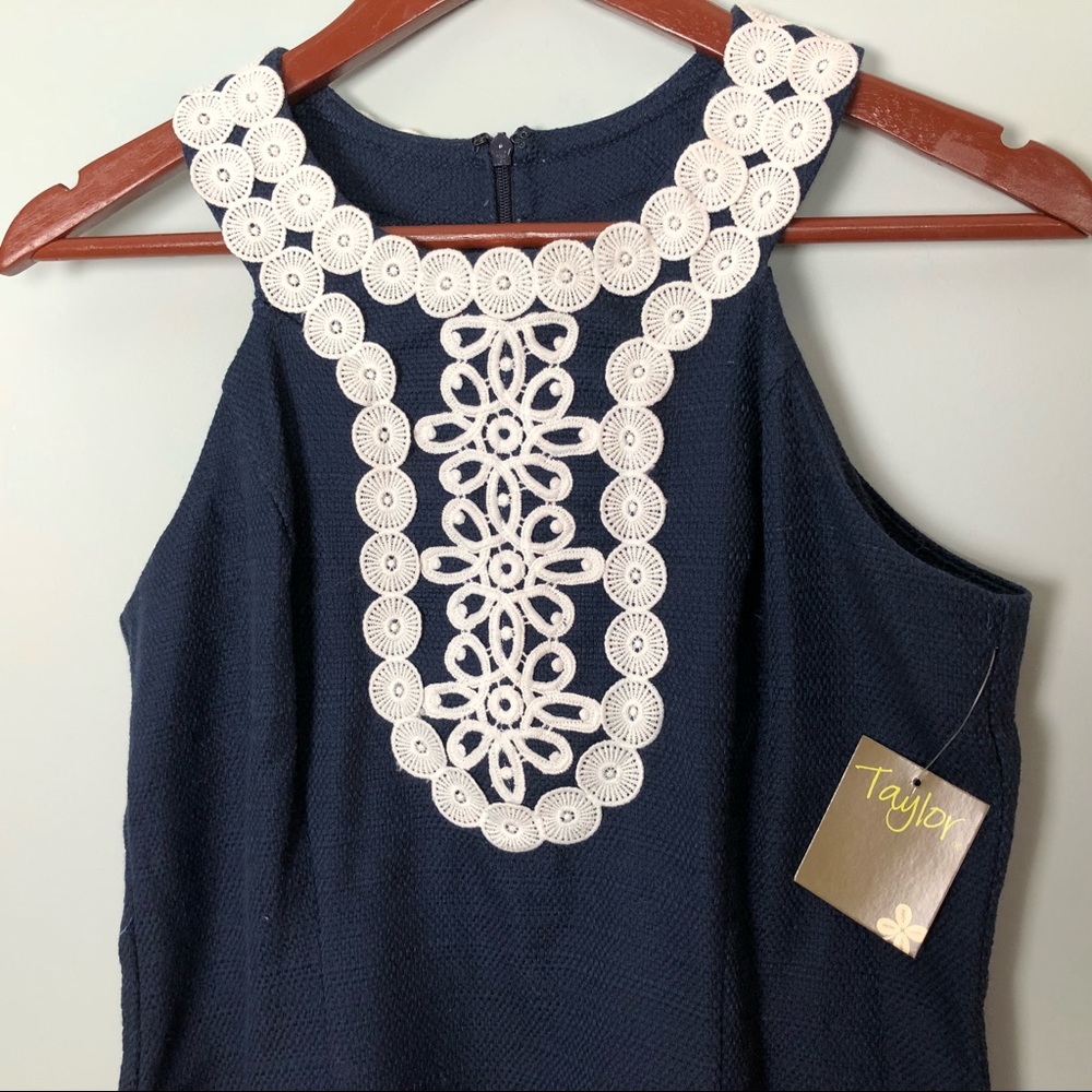Taylor sleeveless blue dress with lace bib detail